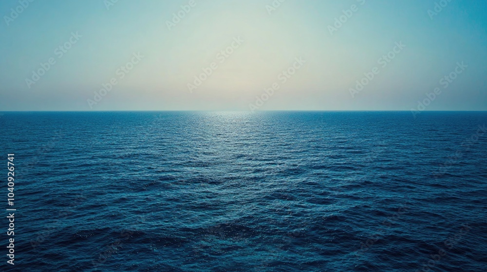 Fototapeta premium Serene Blue Hues Over Calm Ocean Waters