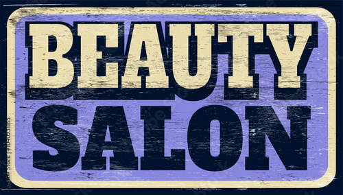 Aged and worn beauty salon sign on wood