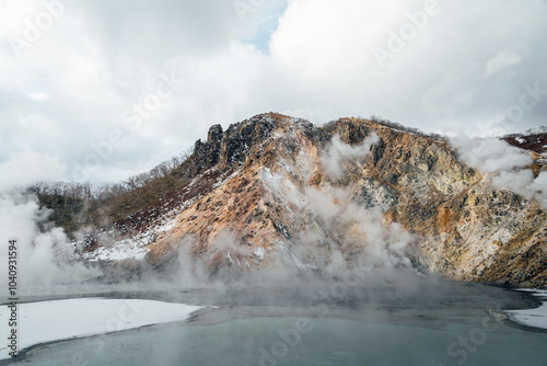 Steam hot springs and snow scene in Noboribetsu Hell Valley, Hokkaido, Japan photo