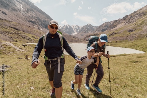 Family hiking in the wild photo