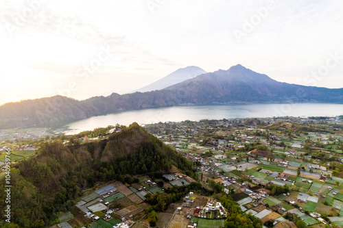 Sunrise view of Trunyan and Agung in Kintamani Bali, Indonesia photo