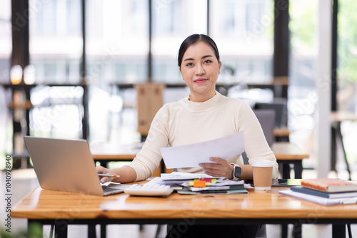 Wallpaper Mural Business financing accounting banking concept. Business woman hand doing finances and calculate on desk about cost at home office. Woman working on desk with using calculator, finance accounting.
 Torontodigital.ca