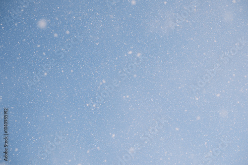 Falling snowflakes background in the sky