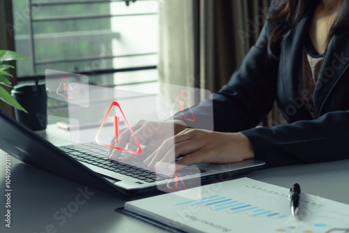 Cyber attack. Businesswoman typing  laptop with red warning icons Cyber attack on computer network,  Spyware, Virus, displayed on the screen in alarm caution warning