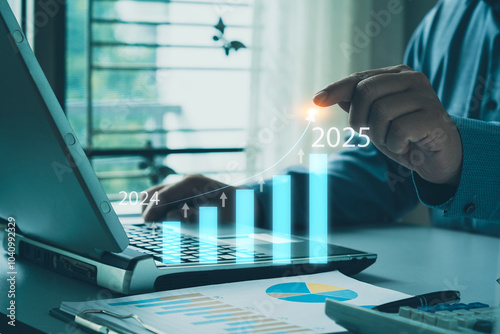 Business investment concept. Businessman pointing at computer Business plan Developing a new year 2025 strategic plan Investment information and business goals Professional planning