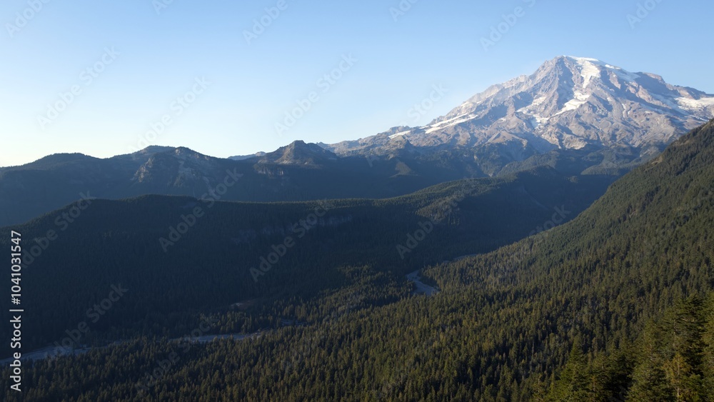 Fototapeta premium Majestic Mount Rainier Rising Above Forested Slopes, Washington State, USA