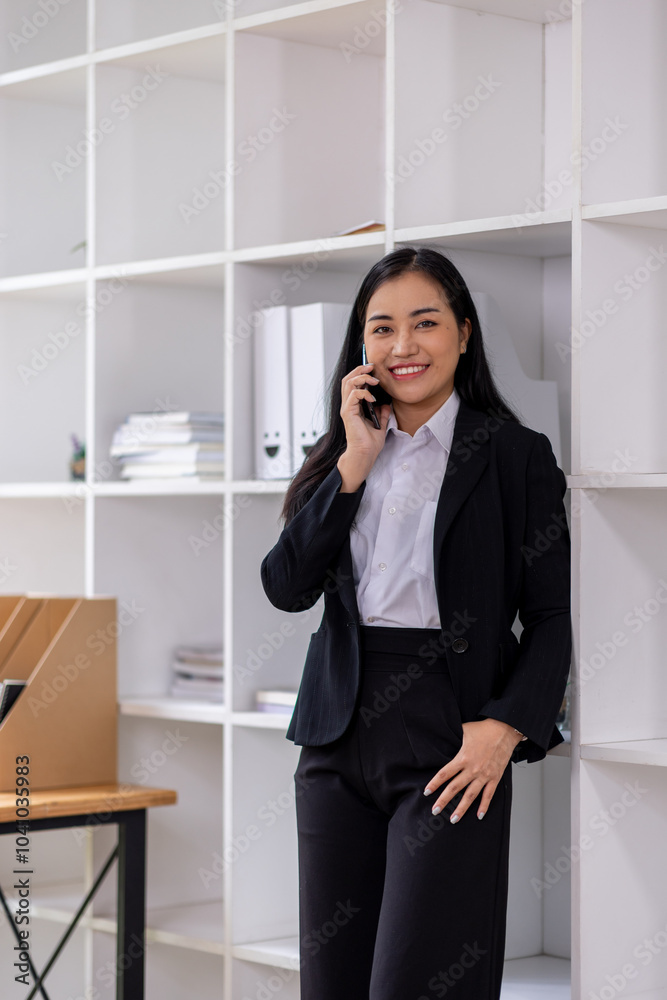 asian woman talking on the phone while working on computer in desk office. Searching on internet
asian woman talking on the phone while working on computer in desk office. Searching on internet