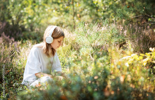 Girl listening to music with headphones.