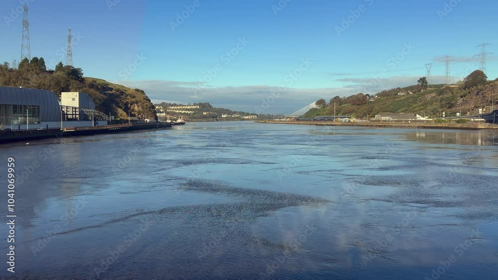 Light mist drifts on River Suir looking upstream at Waterford, Ireland