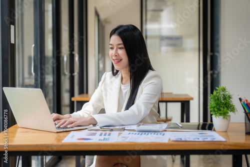 Confident Businesswoman Working on Laptop 