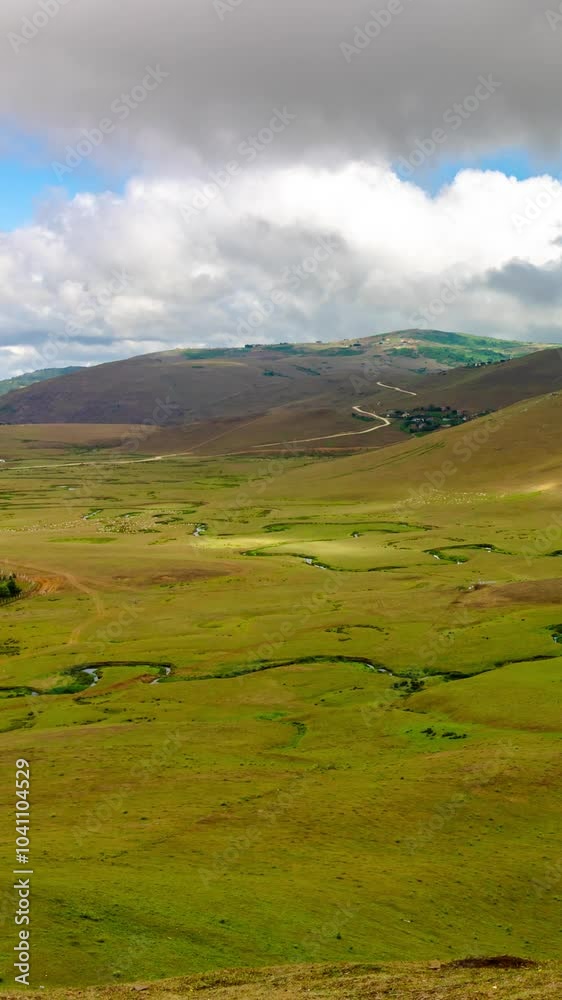 Moving clouds over the highland with meanders. Nature time lapse vertical video. Moving clouds over the highland with meanders. Nature time lapse vertical video.