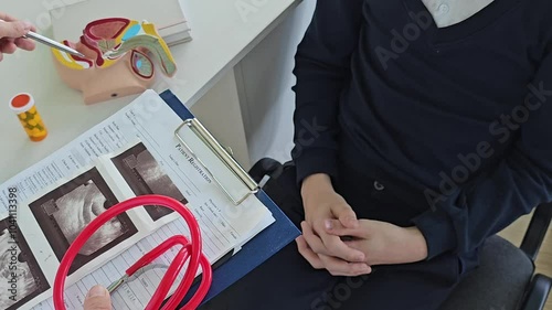 Man holds hand on private parts feeling discomfort and consults doctor. Sexually transmitted testicular cancer