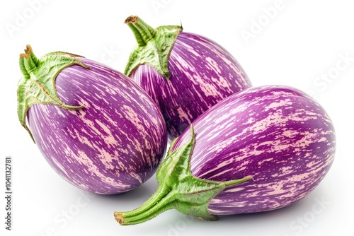 Three purple eggplants arranged on a clean white surface