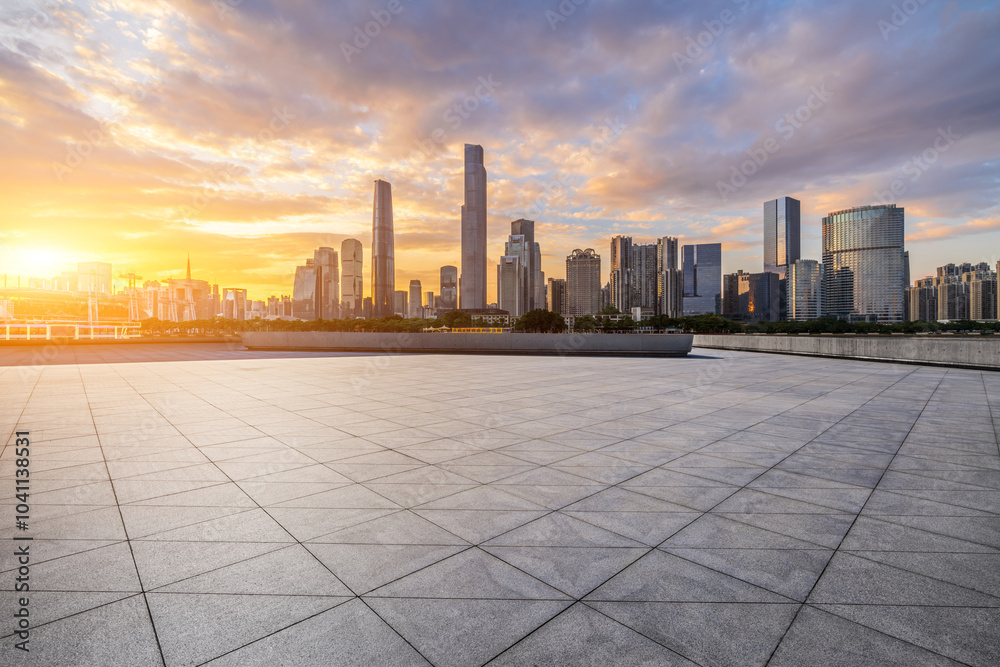 Empty square floor with modern city buildings scenery at sunset in Guangzhou. car advertising background.