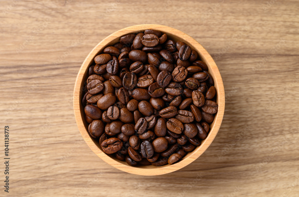 roasted coffee bean (Arabica coffee) in bowl on wooden background, Table top view roasted coffee bean (Arabica coffee) in bowl on wooden background, Table top view