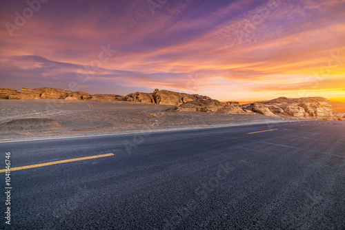 Asphalt road highway and yardang landform mountain natural landscape at sunset. road trip.
