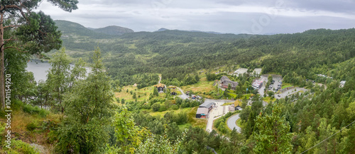 Panoramic view of Preikestolen BaseCamp nestled in Norway's lush landscape. A key starting point for the famous Preikestolen hike, surrounded by forests, mountains, and tranquil nature photo