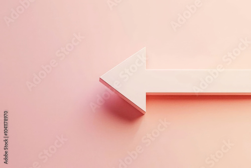 The image features a bold directional arrow prominently displayed against a soft pastel pink background, creating a visually appealing contrast that emphasizes directionality. photo