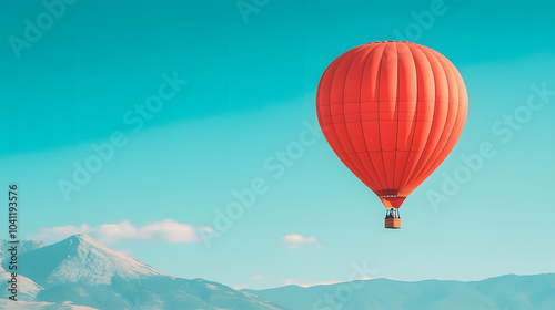 Red Hot Air Balloon Soaring Over Majestic Mountains