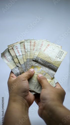 Some 2000 rupiah notes that look a bit worn