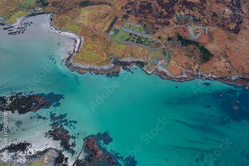 Aerial coastal landscape with turquoise waters.