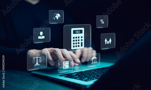 Hand using a laptop with TAX REFUND and refund tax of duty taxation business, graphs and chart being demonstrated on the screen media, tablet pc and selecting tax refund, Saving tax for business