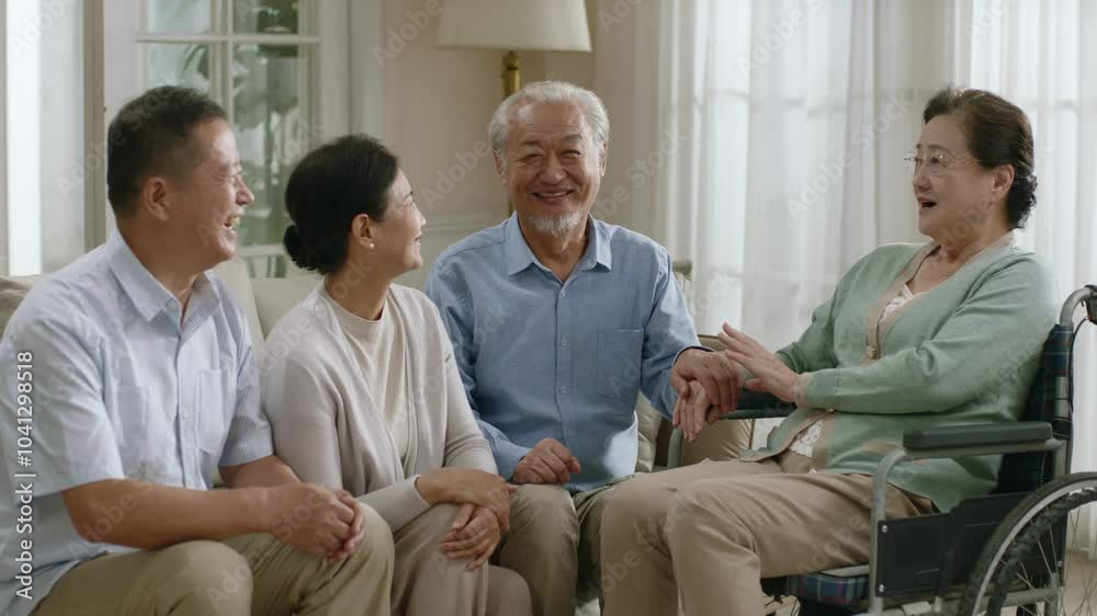 group of happy senior asian people sitting and chatting on family couch group of happy senior asian people sitting and chatting on family couch