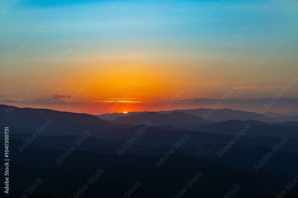 Sunset on the top of the mountain, mountain peaks on the background of the mountain landscape. Sunset on the top of the mountain, mountain peaks on the background of the mountain landscape.
