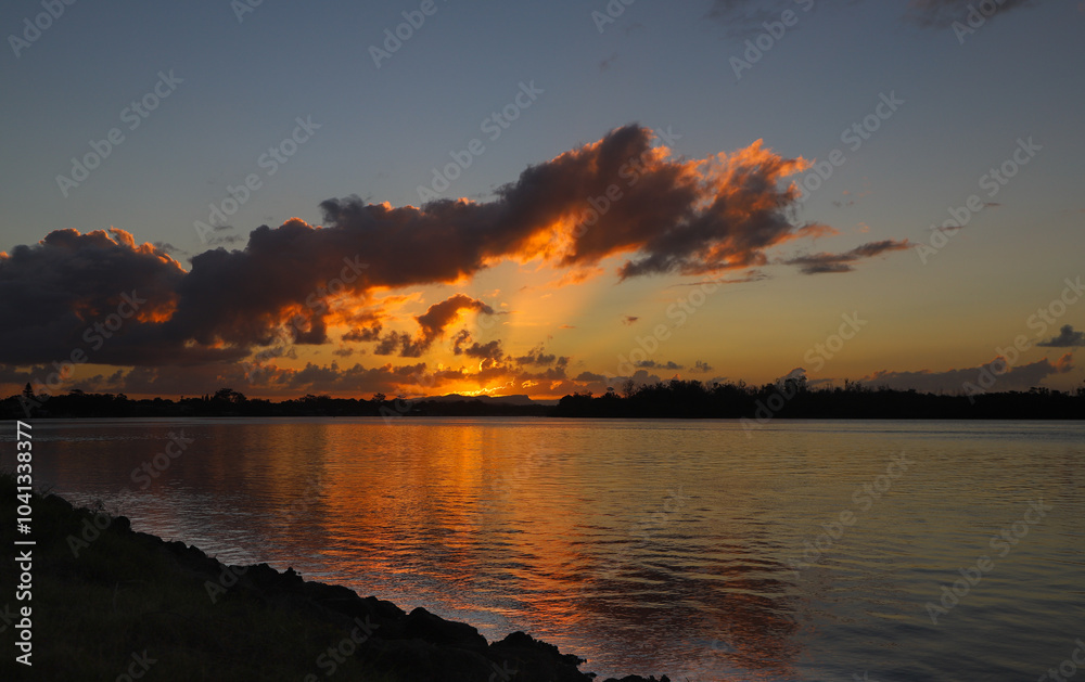 Naklejka premium sunset over the river