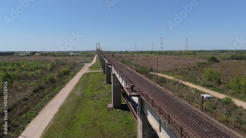 The justo josé de urquiza bridge over a road and river on a sunny day, aerial view photo