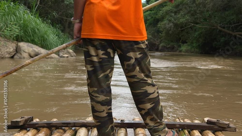 Bamboo rafting on a mody river. photo