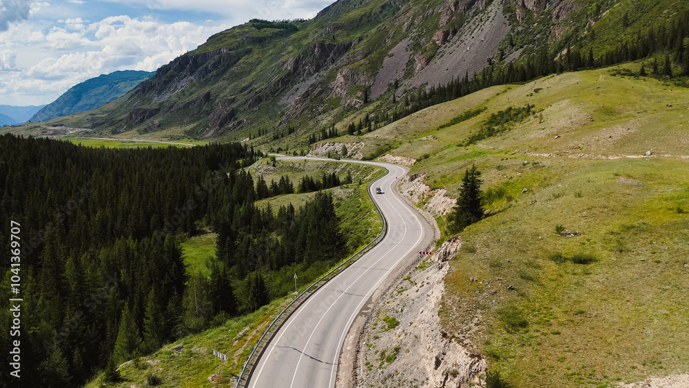the car is driving along a mountain road in Altai the car is driving along a mountain road in Altai