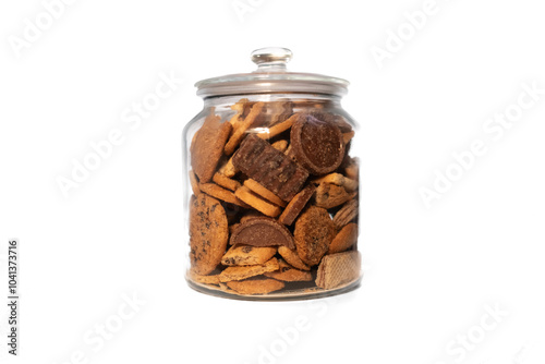 Glass jar full of assorted biscuits on a pure white background