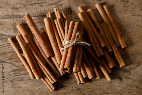 cinnamon sticks on wooden background