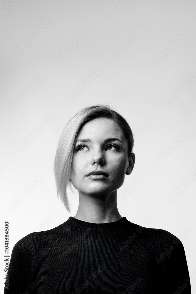 Minimalist portrait of a young woman. Wide space creating a versatile graphic image. Use in creative designs and editorial layouts. Clean composition and use of space Minimalist portrait of a young woman. Wide space creating a versatile graphic image. Use in creative designs and editorial layouts. Clean composition and use of space