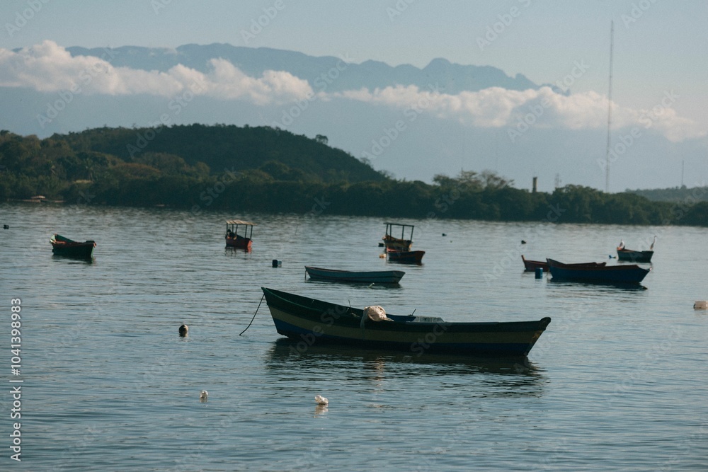 custom made wallpaper toronto digitalBoats floating on a calm lake with mountain backdrop.