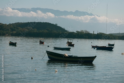 Wallpaper Mural Boats floating on a calm lake with mountain backdrop. Torontodigital.ca