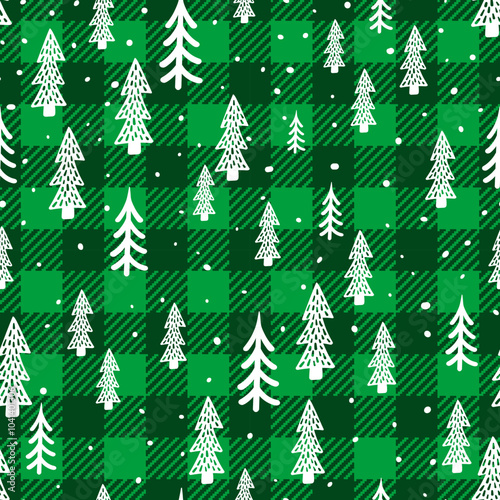 Trendy Christmas seamless pattern. Green Buffalo Plaid background with white Christmas tree texture. Vector checkered plaid and cute winter forest hand drawn print for fashion, fabric, wrapping paper.