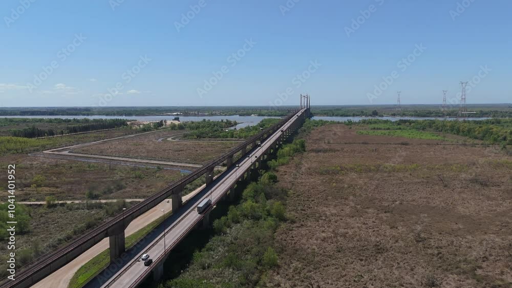 The justo josé de urquiza bridge stretching across vast wetlands and the Paraná Guazú river on a sunny day, aerial view The justo josé de urquiza bridge stretching across vast wetlands and the Paraná Guazú river on a sunny day, aerial view