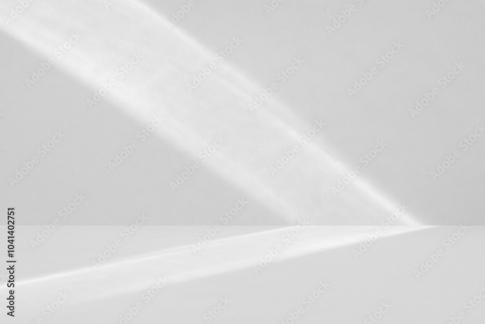 Abstract white studio room with light and shadow from window background for product display presentation Abstract white studio room with light and shadow from window background for product display presentation