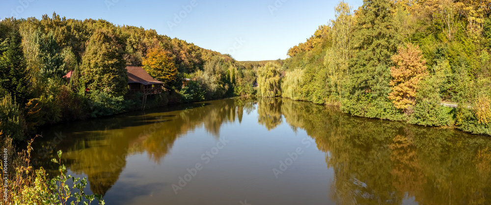 Lake panorama in the forest, autumn forest around the lake Lake panorama in the forest, autumn forest around the lake