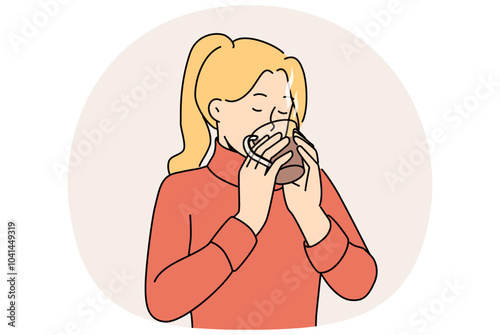 Woman drinks hot tea to keep warm and quench thirst after walk in park in cold winter weather. Girl in sweater holds mug of tea and enjoys taste and aroma of drink made from natural herbs