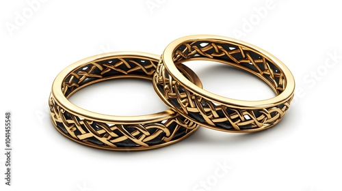 Intricate gold wedding bands with celtic knot design on white background