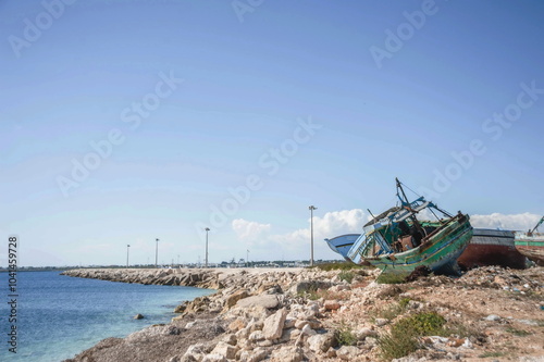 fishing boats in harbour in Portopalo in Sicily photo