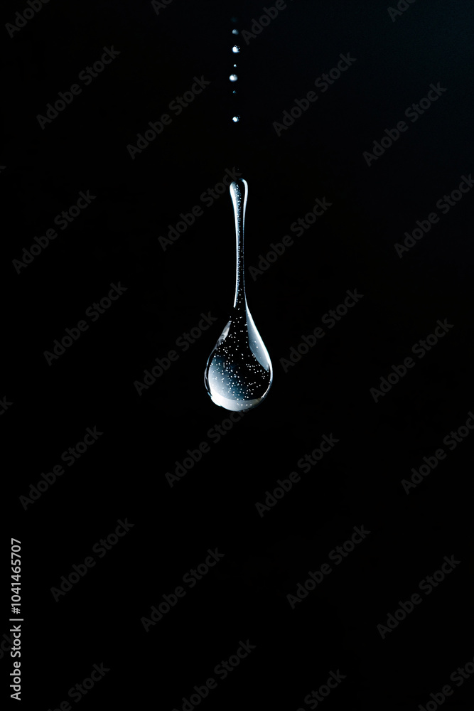 water droplet on black background water droplet on black background