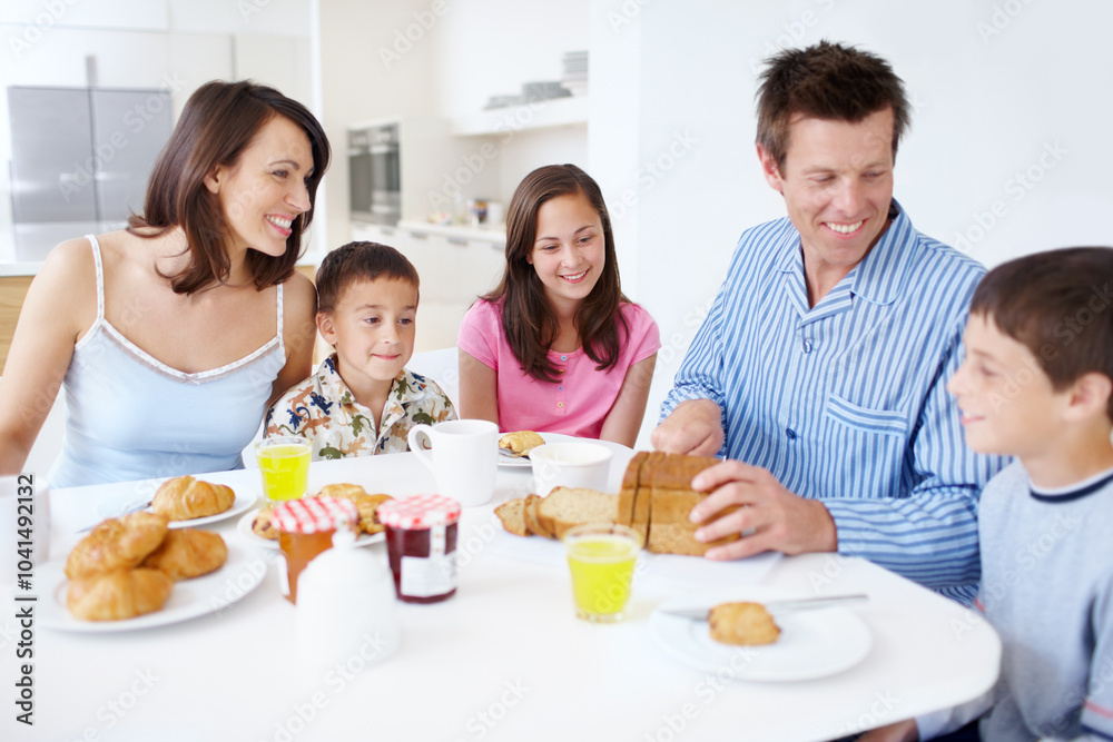 Family, conversation and morning breakfast in home, dining table and support with healthy food. Parents, children and talking together in kitchen with meal, love and brunch nutrition for bonding Family, conversation and morning breakfast in home, dining table and support with healthy food. Parents, children and talking together in kitchen with meal, love and brunch nutrition for bonding