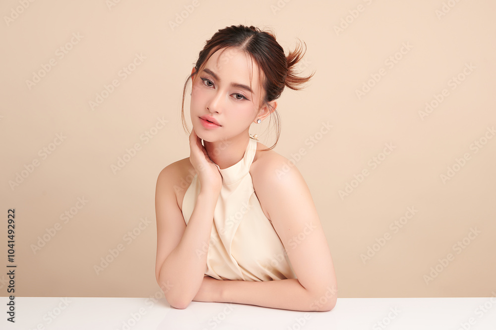 Beautiful young asian woman with clean fresh skin on beige background, Face care, Facial treatment, Cosmetology, beauty and spa, Asian women portrait. Beautiful young asian woman with clean fresh skin on beige background, Face care, Facial treatment, Cosmetology, beauty and spa, Asian women portrait.