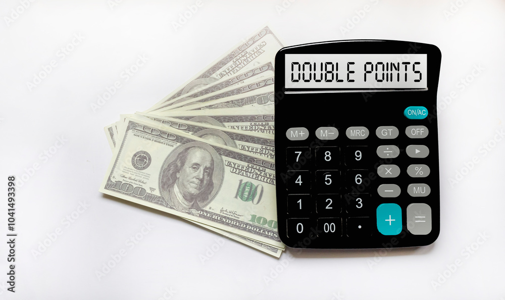 The text on the calculator display with double points on a white background with dollars The text on the calculator display with double points on a white background with dollars