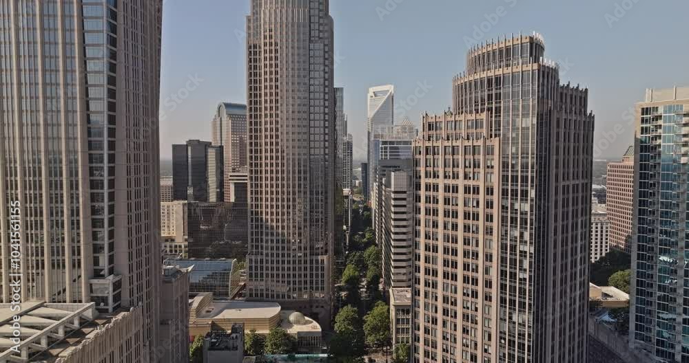 Charlotte North Carolina Aerial v182 low flyover Tryon street through city center capturing downtown cityscape with towering skyscrapers along the street - Shot with Mavic 3 Pro Cine - Oct 2st 2023 Charlotte North Carolina Aerial v182 low flyover Tryon street through city center capturing downtown cityscape with towering skyscrapers along the street - Shot with Mavic 3 Pro Cine - Oct 2st 2023
