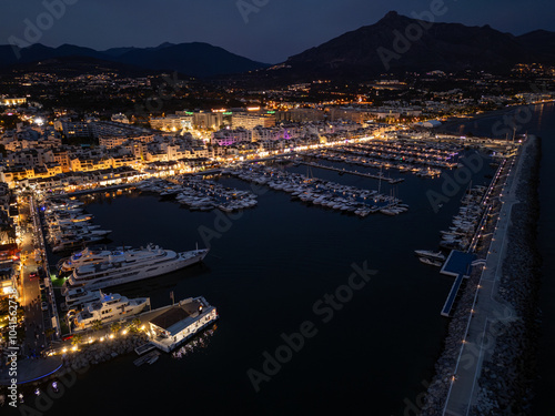 Aerial night shot of Puerto Banús and La Concha mountain
